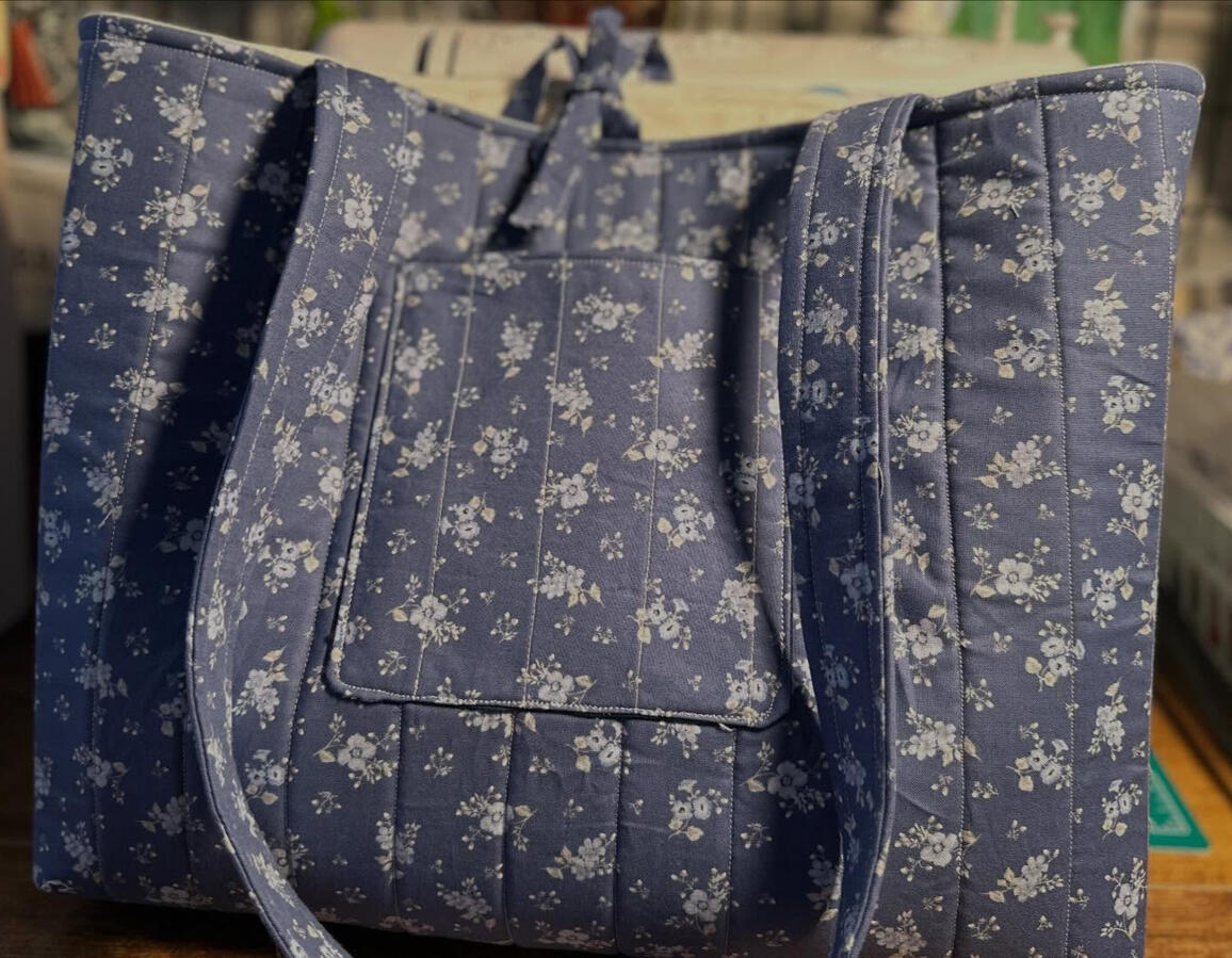 Quilted tote with exterior pocket. Spacious, structured, and handmade. Custom fabric options available. $75