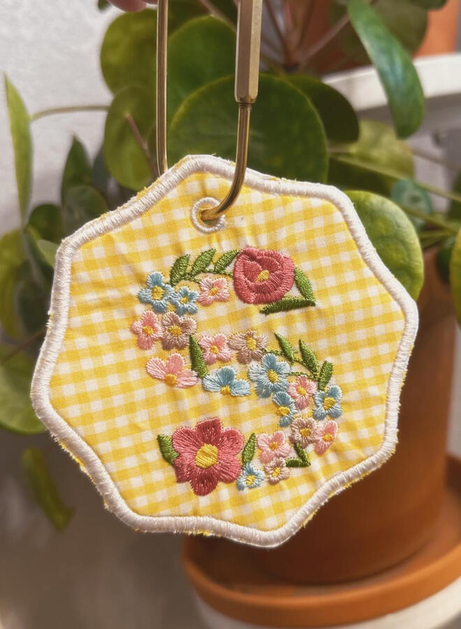 Machine embroidered book tags, perfect for adding a little personality to your bag. Customize with your choice of thread and fabric colors. Finished with a gold carabiner for easy attachment. $15