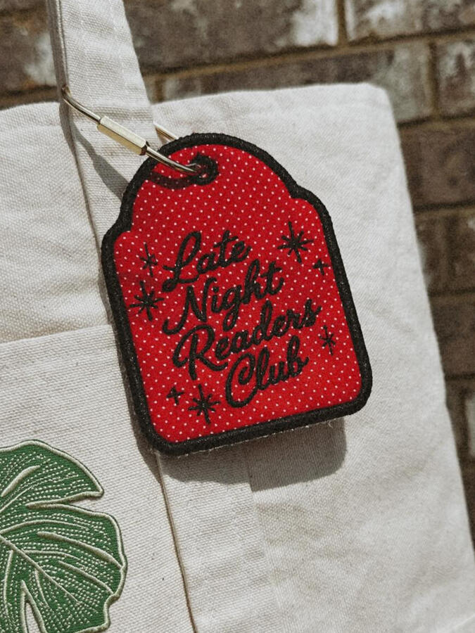 Machine embroidered book tags, perfect for adding a little personality to your bag. Customize with your choice of thread and fabric colors. Finished with a gold carabiner for easy attachment. $15
