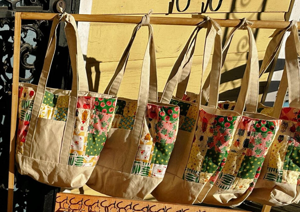 A little structure, a little patchwork, and a lot of personality! This canvas tote is made for everyday use with two exterior pockets and a soft cotton lining. Customize your patchwork colors to make it yours. $50