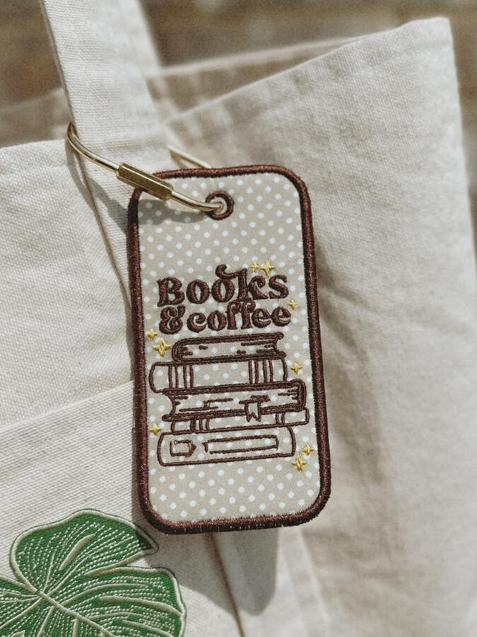 Machine embroidered book tags, perfect for adding a little personality to your bag. Customize with your choice of thread and fabric colors. Finished with a gold carabiner for easy attachment. $15