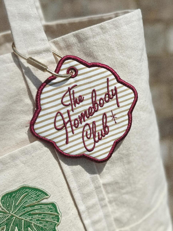 Machine embroidered book tags, perfect for adding a little personality to your bag. Customize with your choice of thread and fabric colors. Finished with a gold carabiner for easy attachment. $15